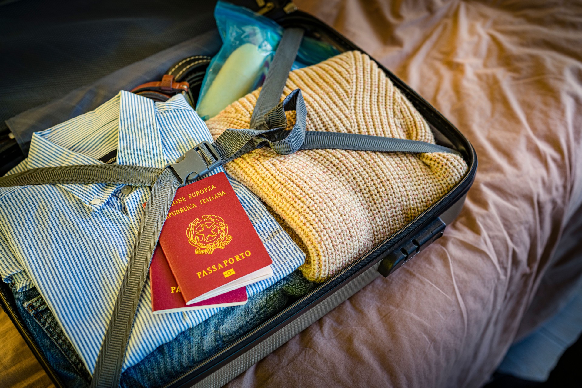 Italian passports and suitcase ready for a trip